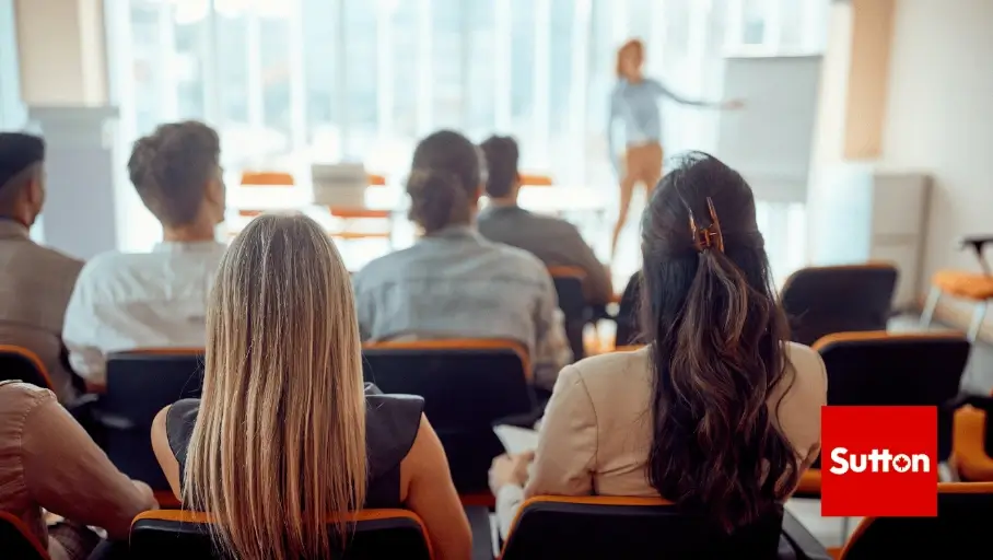 Successful agents discussing career growth at Sutton Group Ottawa